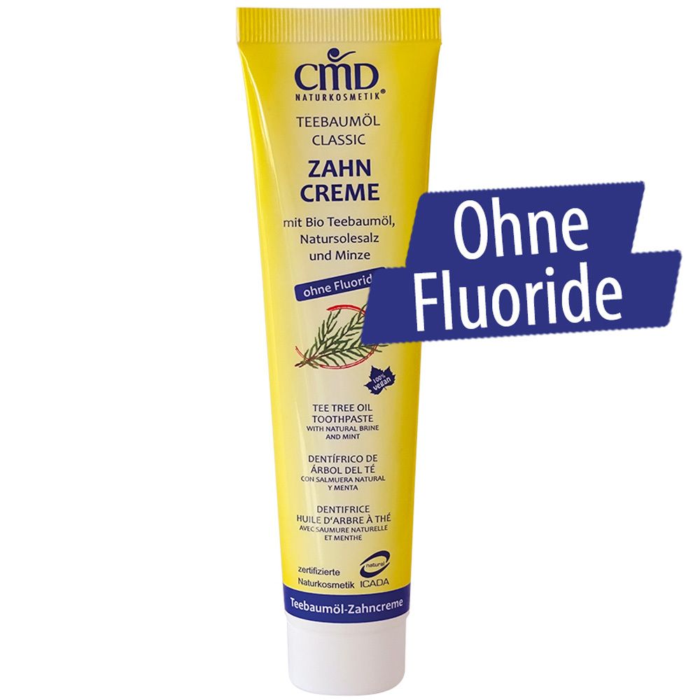 Tubo giallo di dentifricio CMD Teebaumöl. Scritta: Senza fluoro. Contiene olio di tea tree bio, sale marino naturale e menta.
