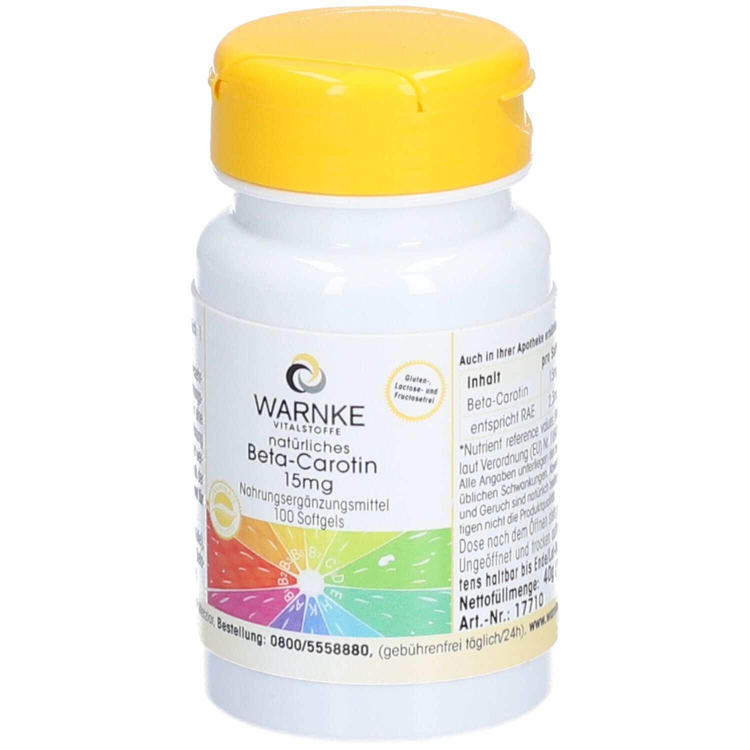 Flacone bianco con coperchio giallo. Scritta: WARNKE Beta-Carotin 15mg. 100 capsule. Arcobaleno colorato.