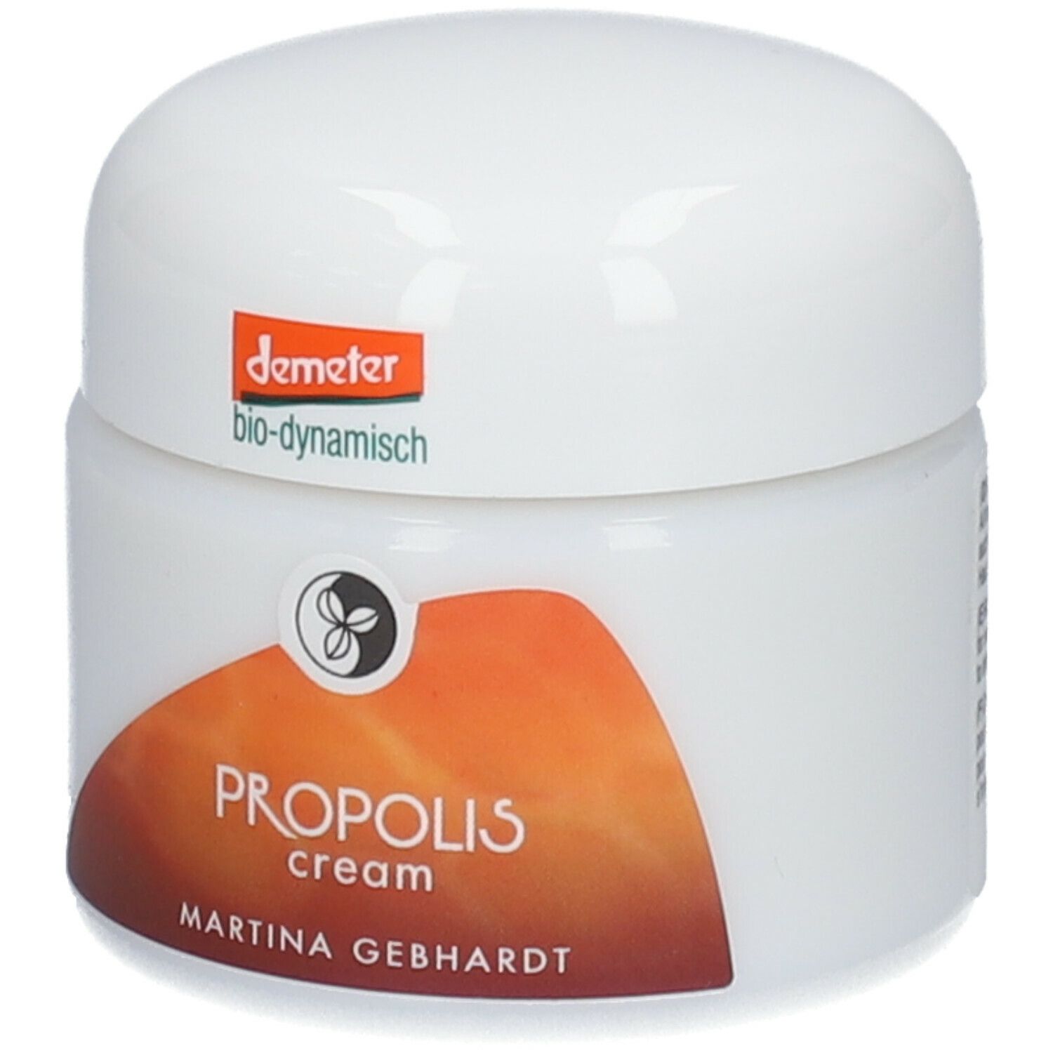 Vasetto di crema con coperchio. Scritta: PROPOLIS cream, MARTINA GEBHARDT. Logo e marchio Demeter.