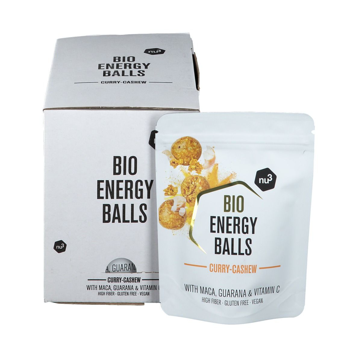 Confezione in cartone bianco e busta con scritta "BIO ENERGY BALLS Curry-Cashew". La busta mostra l'immagine del prodotto e gli ingredienti.