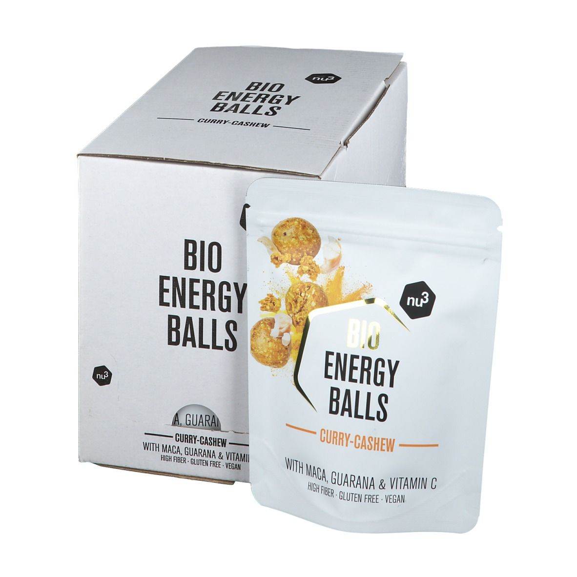 Confezione in cartone bianco e busta con scritta "BIO ENERGY BALLS Curry-Cashew". La busta mostra l'immagine del prodotto e gli ingredienti.