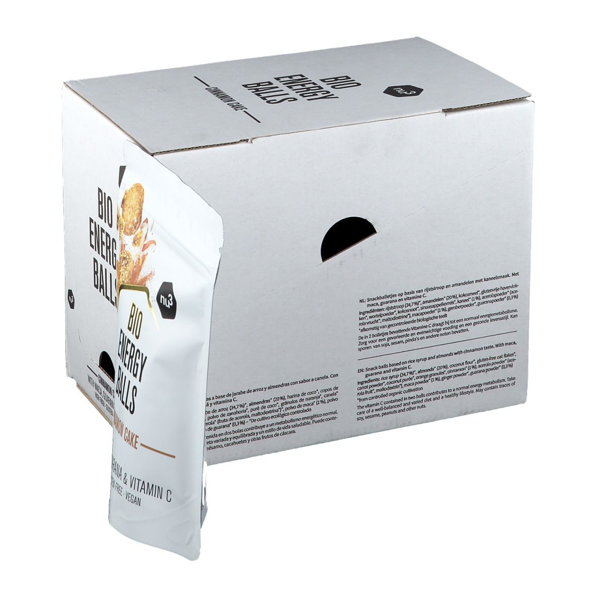 Confezione in cartone bianco con scritta "BIO ENERGY BALLS". Un sacchetto con la scritta "Cinnamon Cake" sporge. Scritte in inglese e tedesco.