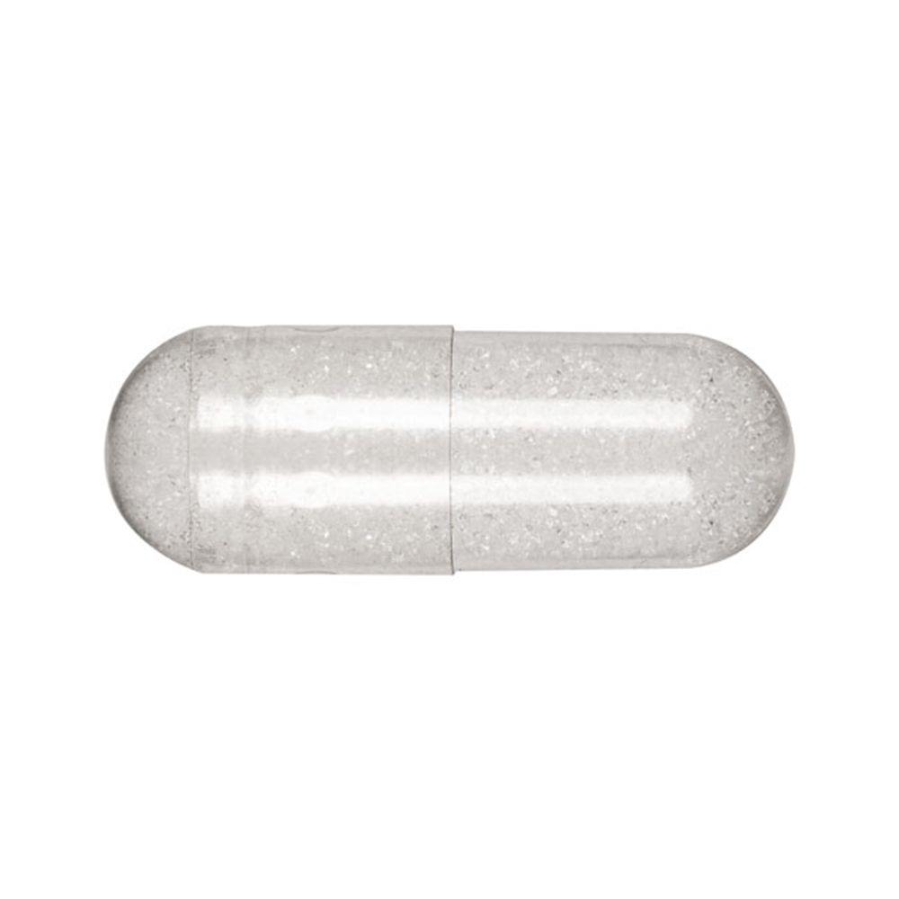 Capsula trasparente con contenuto bianco. Primo piano.