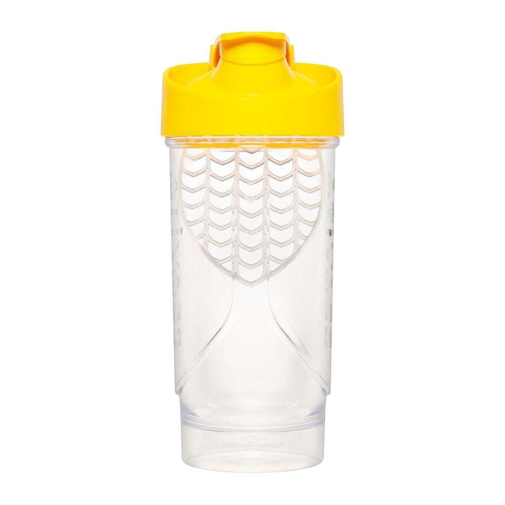 Shaker trasparente con coperchio giallo. Contiene un inserto bianco.