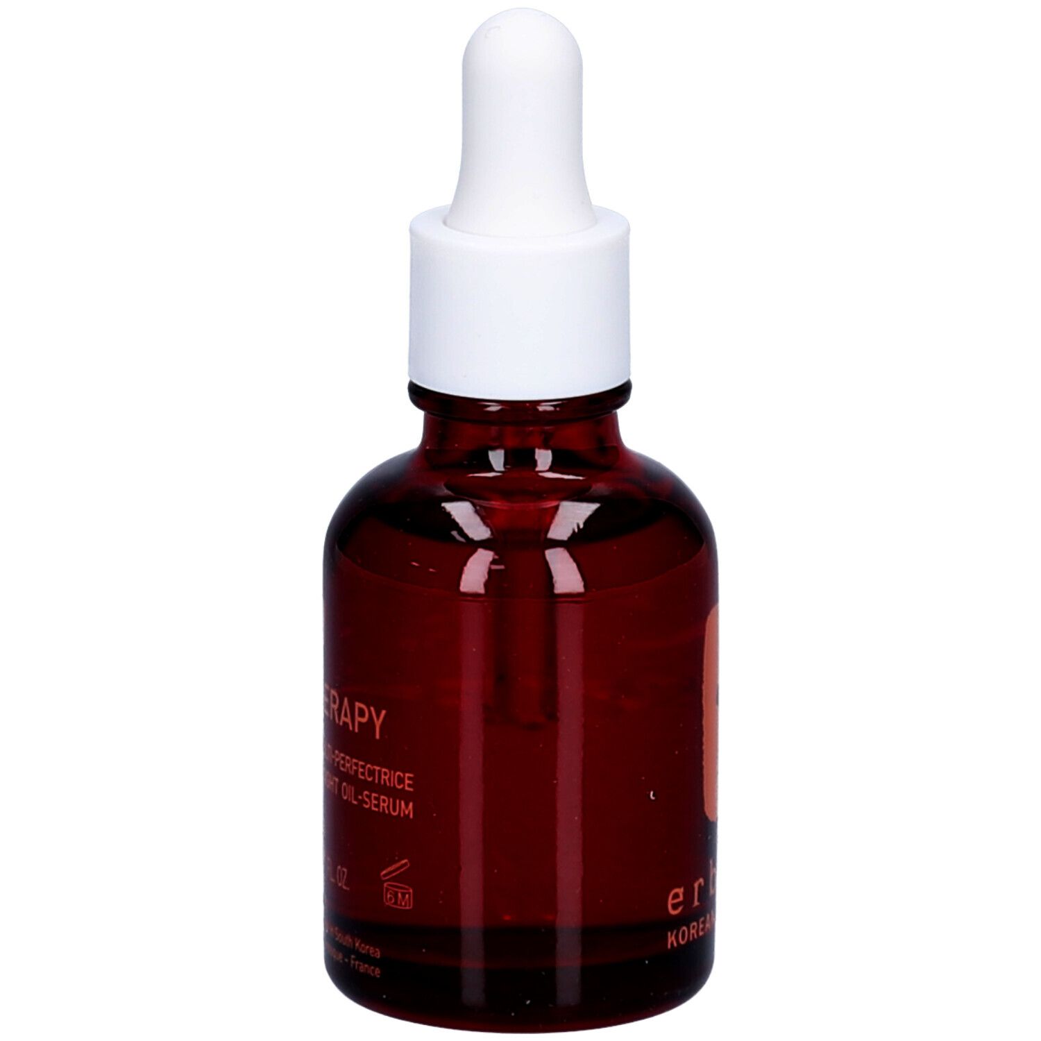 Flacone di vetro marrone con tappo bianco e contagocce. Scritta: Skin Therapy.