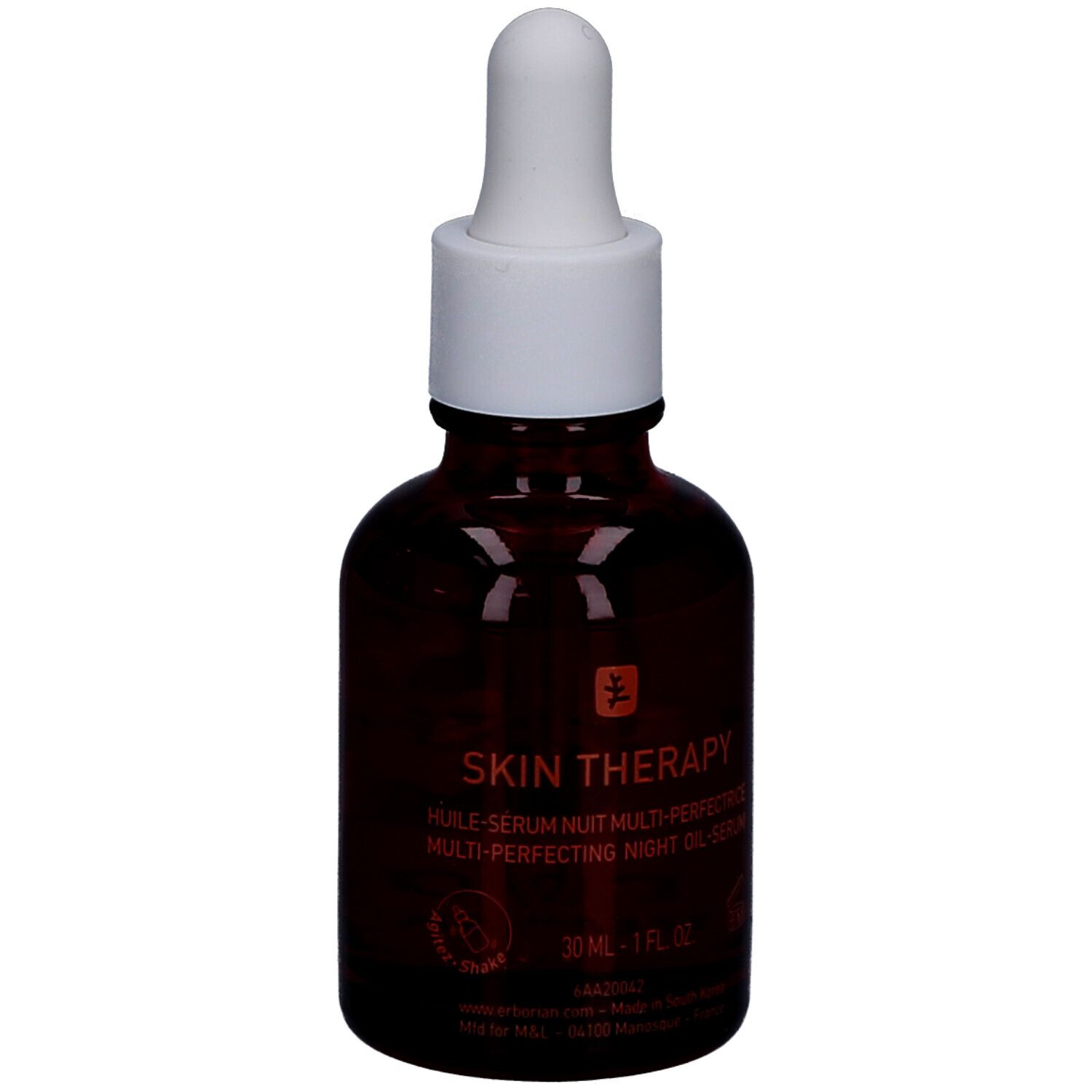 Flacone di vetro marrone con tappo bianco e contagocce. Scritta: Skin Therapy. 30 ml.