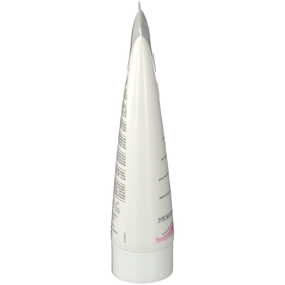 Tubo bianco di crema corpo SYNCHROCELL. Punta, tappo bianco. Testo multilingue.