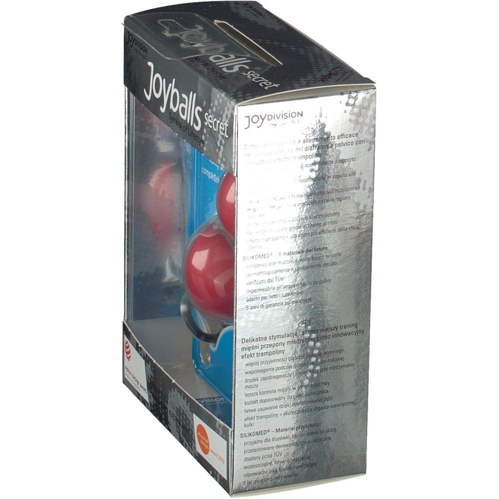 Vista laterale della confezione Joyballs secret. Scatola argentata con immagine del prodotto. Parte anteriore trasparente. Testo in tedesco.