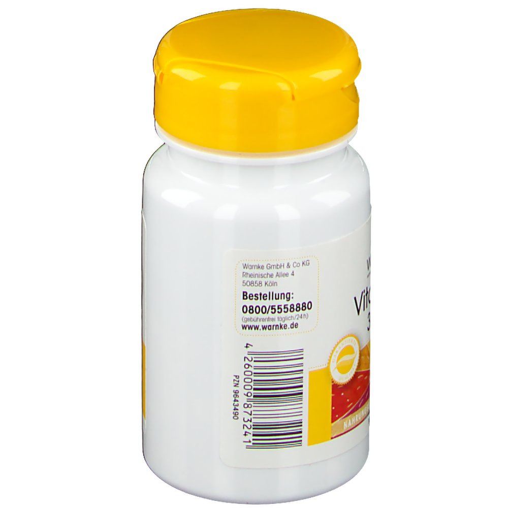 Flacone bianco con tappo giallo. Scritta: WARNKE, numero d'ordine, sito web. Informazioni testuali. Vitamina E, 36mg.