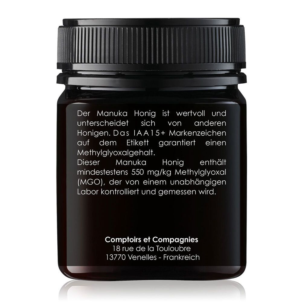 Retro di un barattolo di miele di Manuka. Testo sul valore, marcatura IAA15+, contenuto MGO di 550 mg/kg e controllo di laboratorio indipendente.