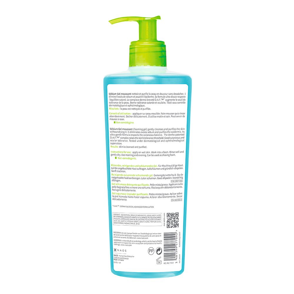 Flacone con pompa blu e testina verde. Contiene gel detergente.
