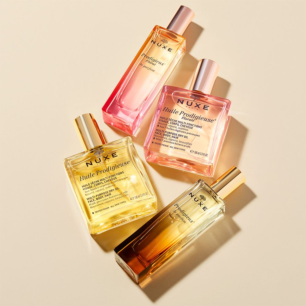 Quattro flaconi e vasetti. Scritta: NUXE, Huile Prodigieuse, Prodigieux le parfum.