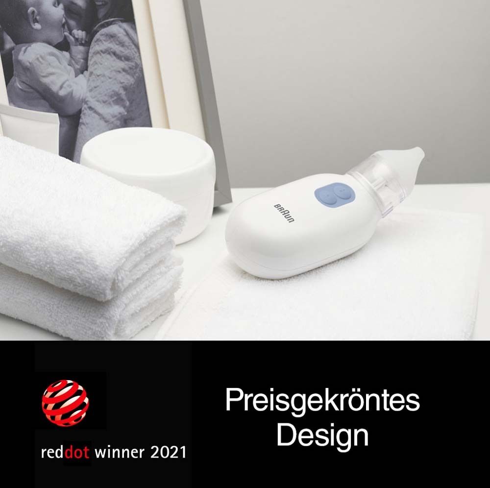 Aspiratore nasale su asciugamano bianco. Premio Red Dot. Testo: Design premiato.