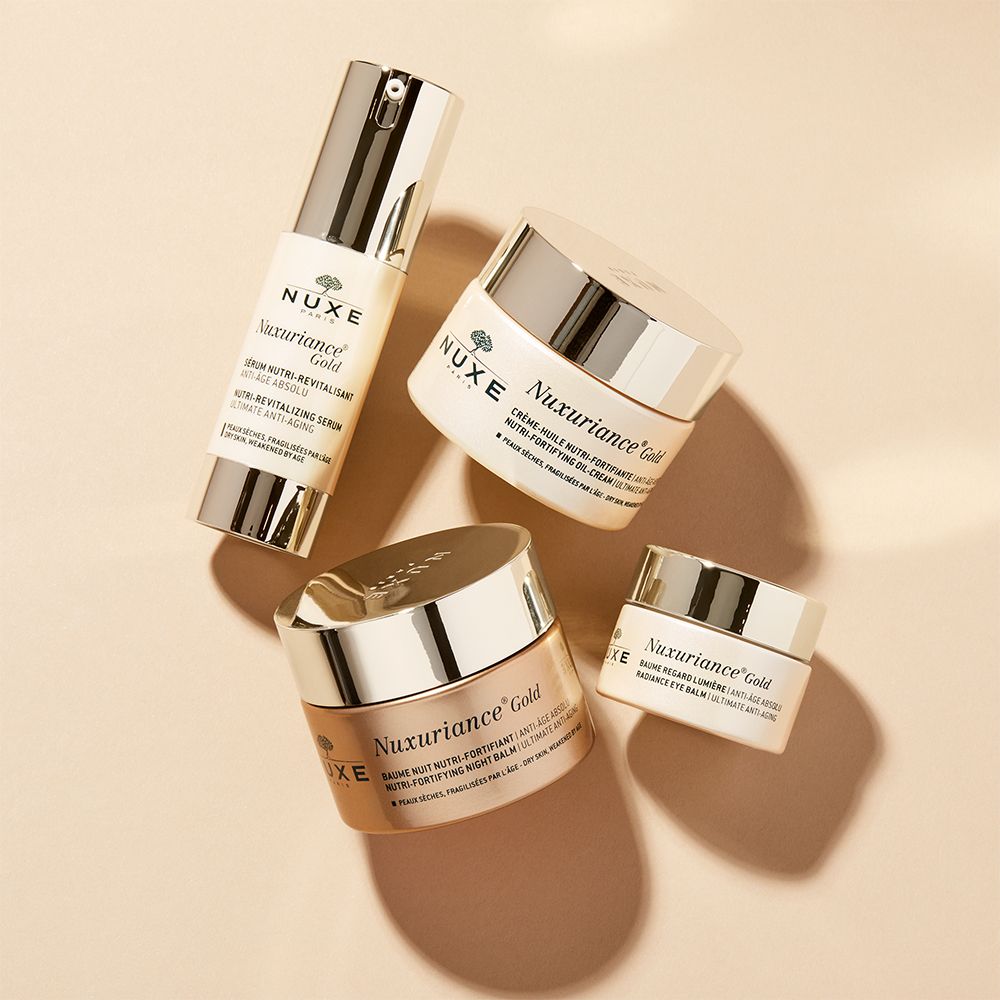 Prodotti cosmetici: siero, due vasetti Nuxuriance Gold e crema occhi.