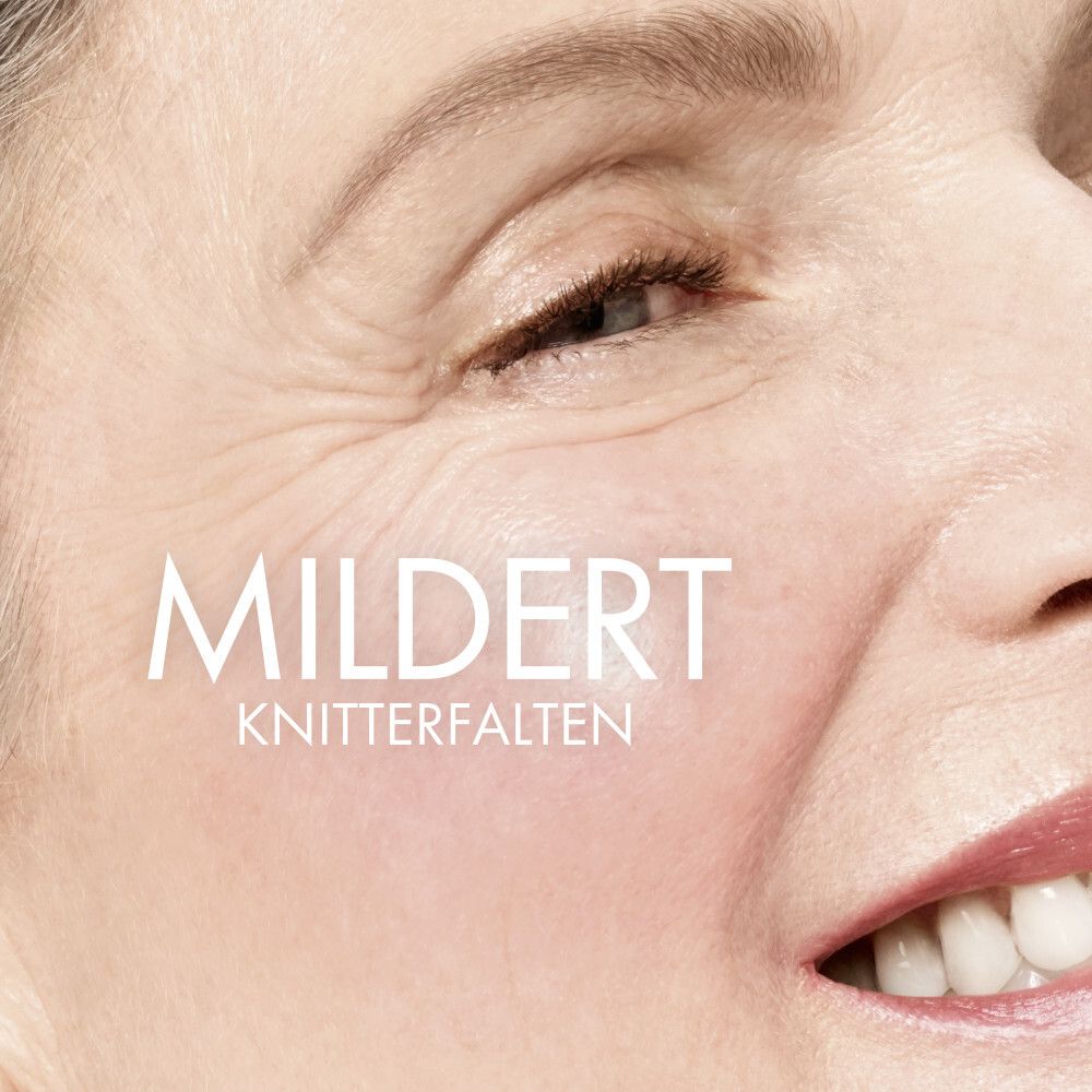 Primo piano di un viso. Testo: MILDERT KNITTERFALTEN.