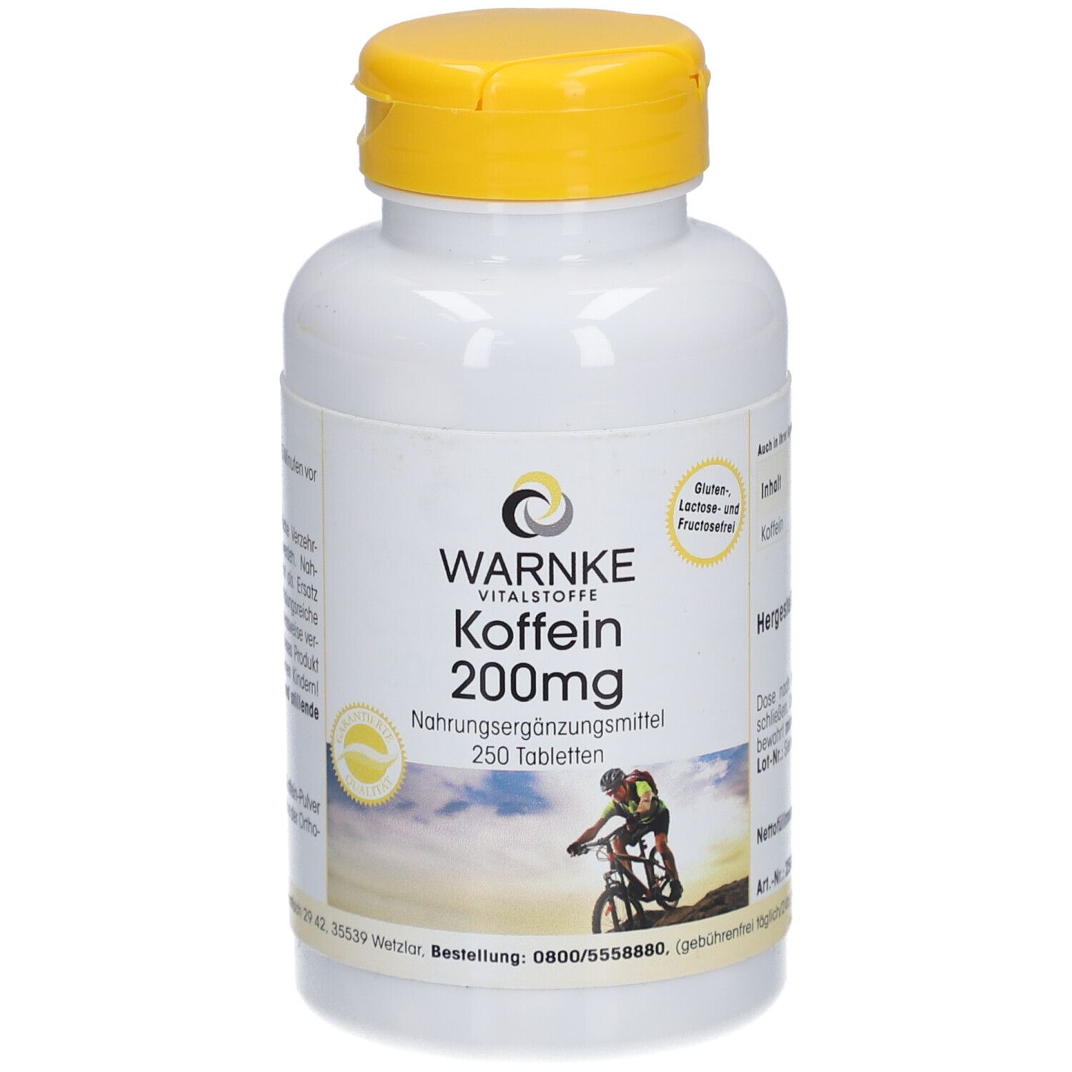 Flacone bianco con tappo giallo. Scritta: WARNKE Koffein 200mg. 250 compresse. Immagine di un ciclista.