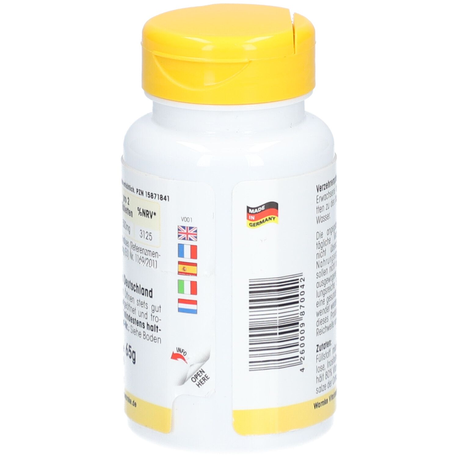 Retro del flacone bianco con tappo giallo. Testo: Vitamina B3, Made in Germany, codice a barre.