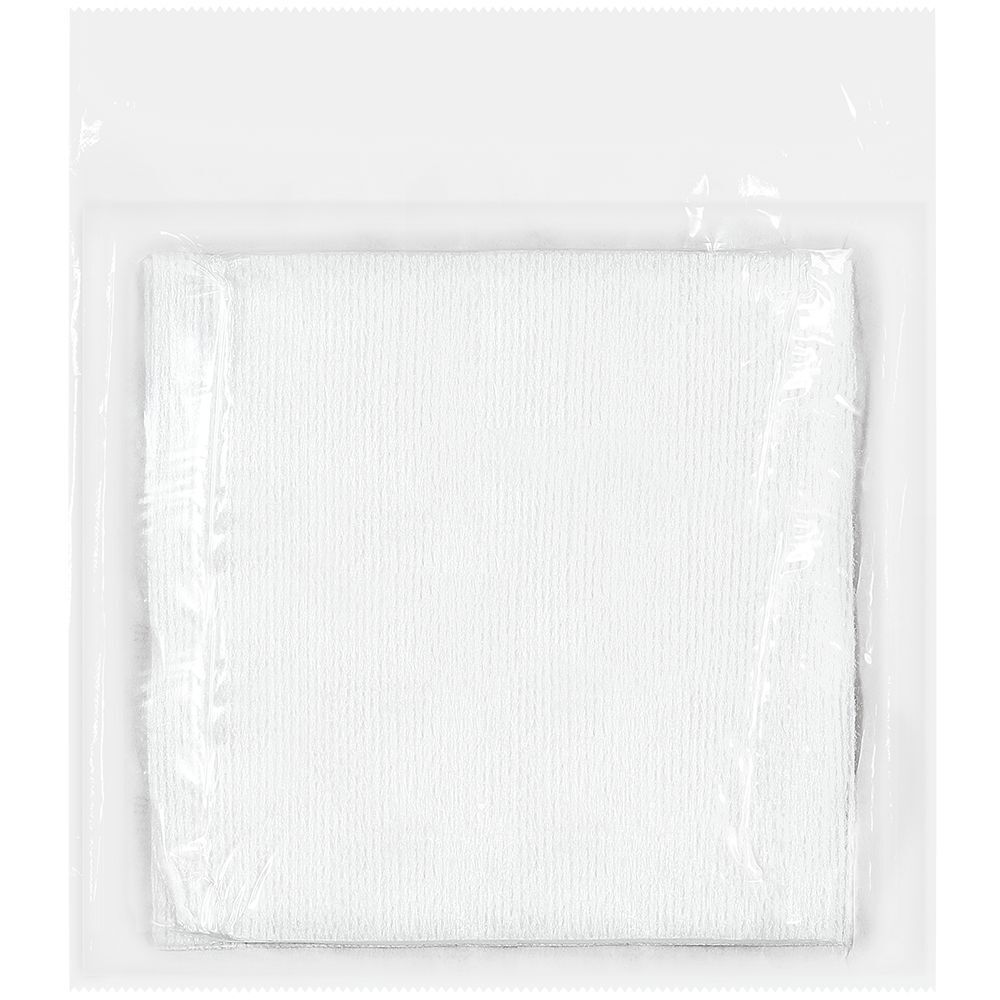 Confezione trasparente con compressa bianca quadrata. Struttura del tessuto non tessuto visibile.