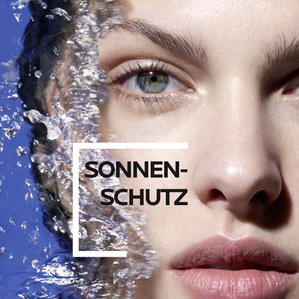 Volto di donna con acqua. Testo: Protezione solare.