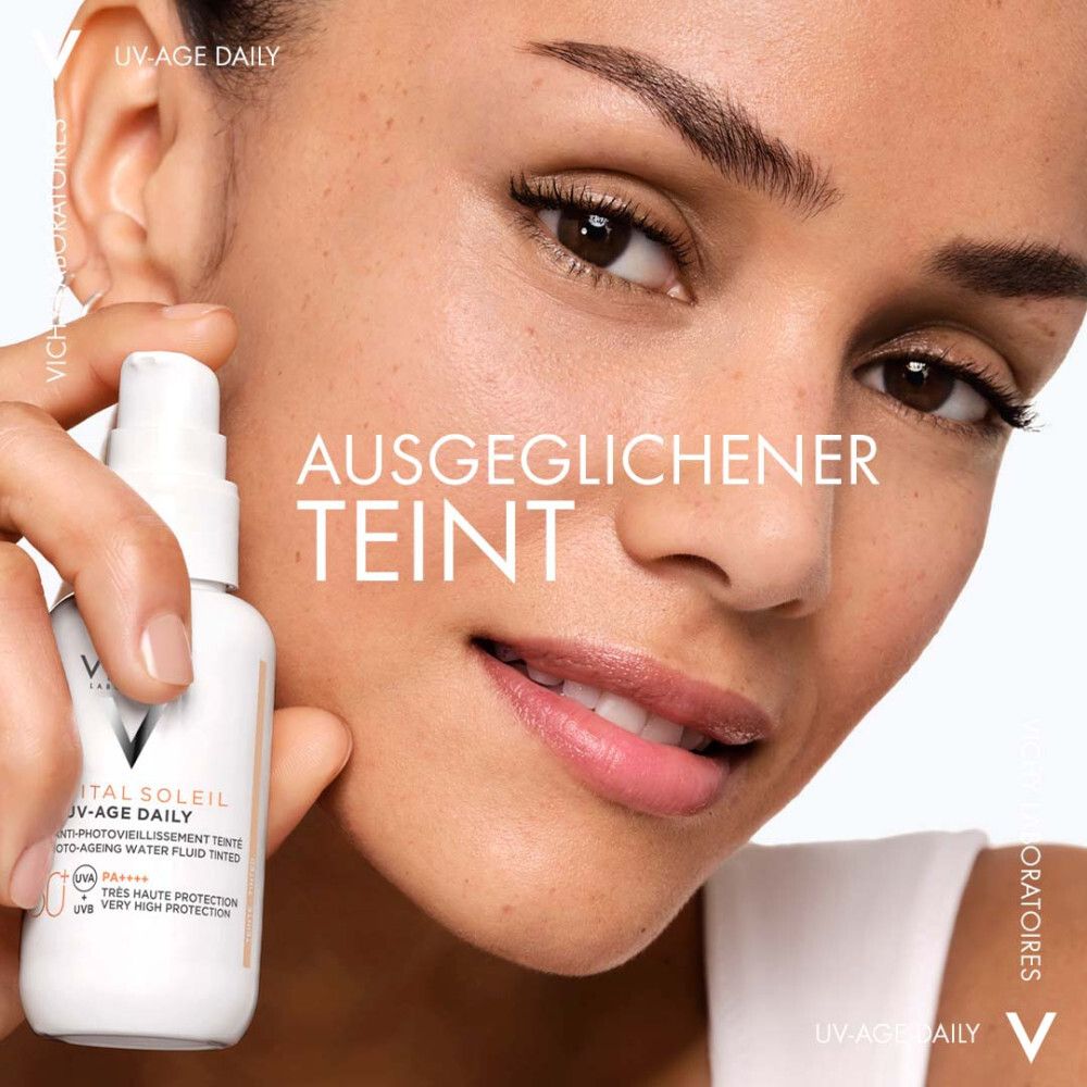 Flacone di prodotto vicino al viso. Testo: -27% macchie. Scritta: Vichy CAPITAL SOLEIL UV-Age Daily.
