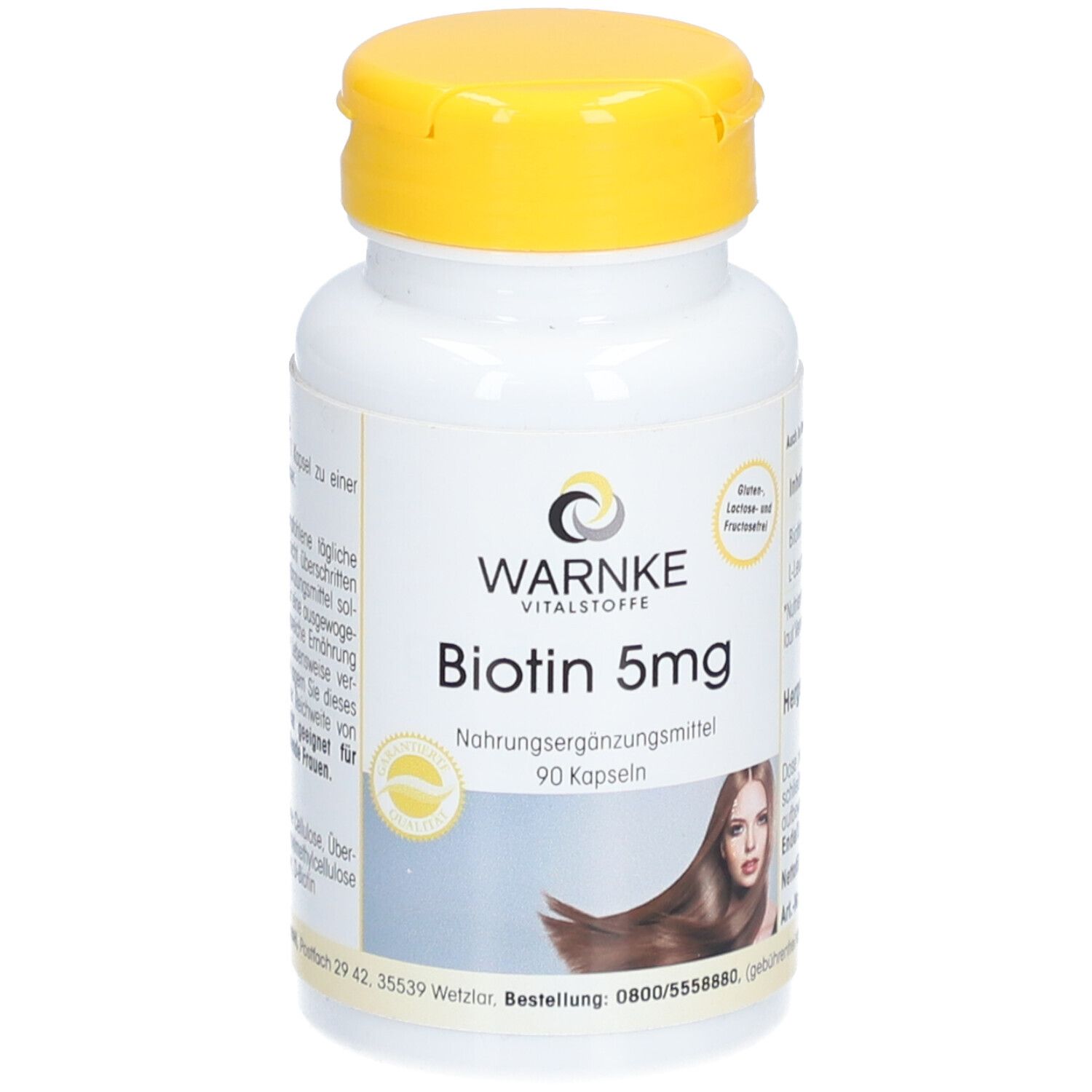 Flacone bianco con tappo giallo. Scritta: Warnke Vitalstoffe, Biotin 5mg, 90 capsule. Immagine di una donna con capelli lunghi.