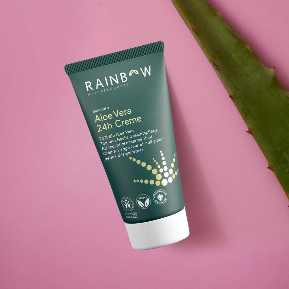 Tubo verde con testo: Rainbow, aloecare, Aloe Vera 24h Creme. Foglia di aloe vera accanto. Loghi e testo.