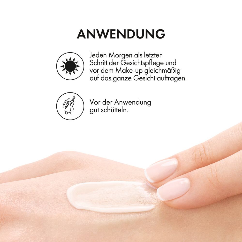 Mano con crema. Testo: Applicazione. Applicare al mattino come ultimo step della cura del viso. Agitare prima dell'uso.