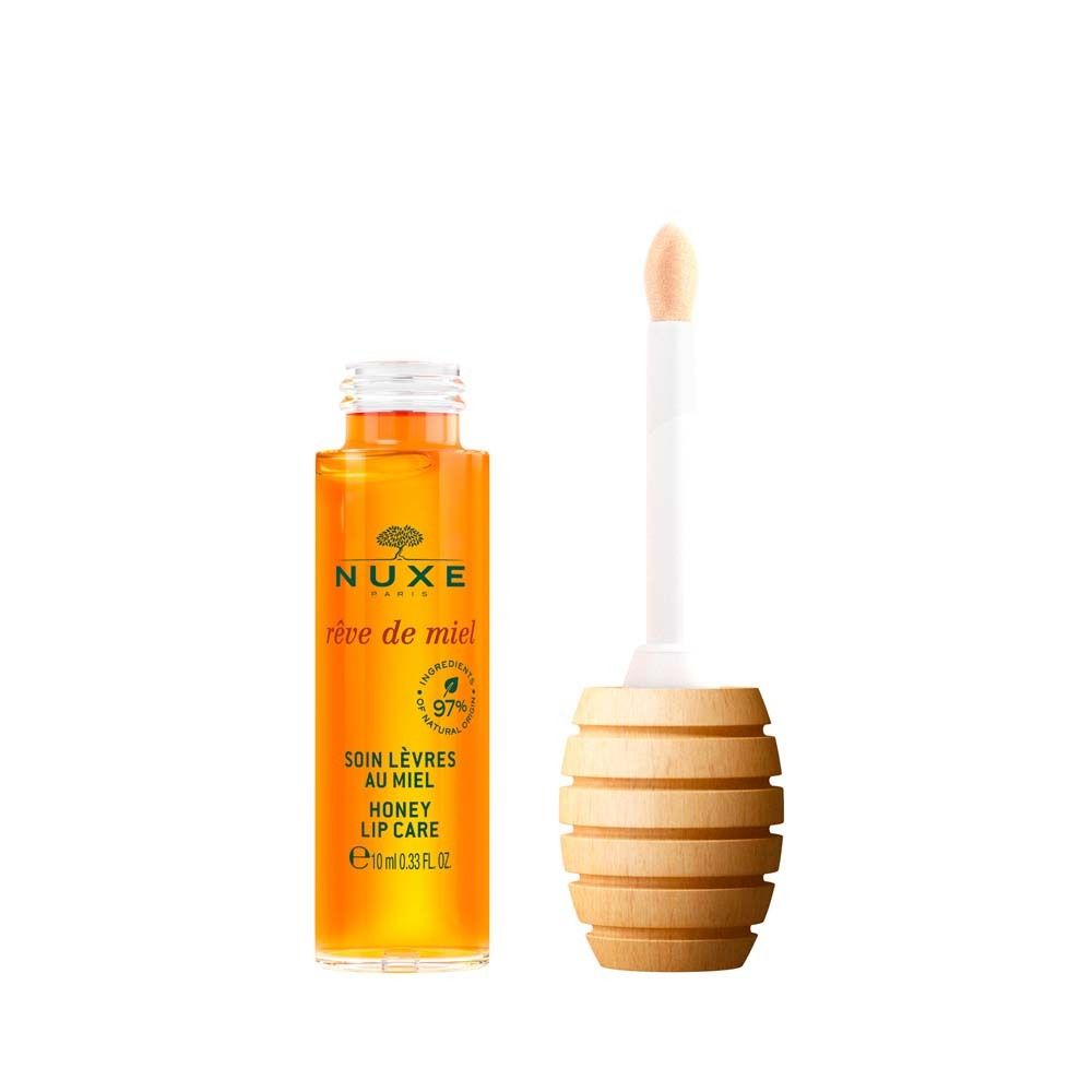 Olio labbra NUXE Rêve de Miel®. Flacone e applicatore. Scritta: Honey Lip Care, 97% ingredienti naturali.