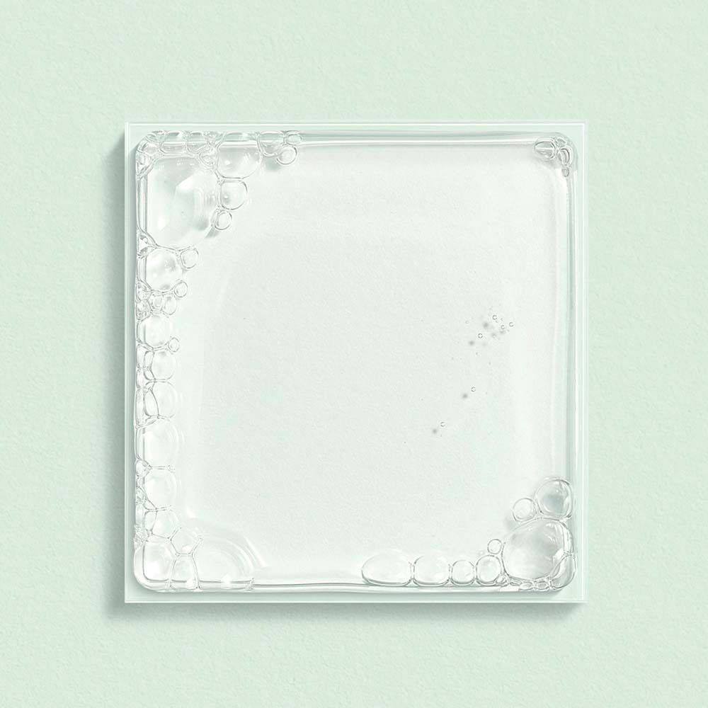 Lastra di vetro quadrata con decorazione di bolle di sapone sui bordi.