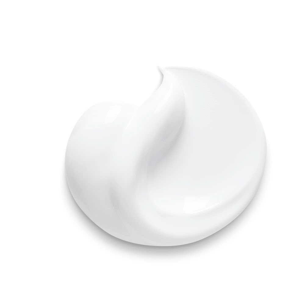 Macchia di crema bianca. Forma rotonda. Superficie liscia. Nessuna etichetta.
