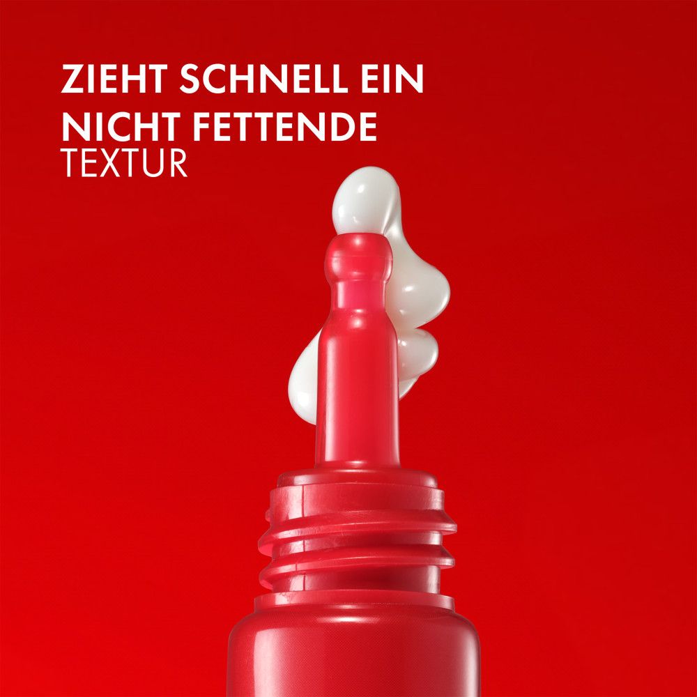 Tubo rosso con contorno occhi. Testo: Assorbimento rapido, texture non grassa. Crema che esce dal tubo.