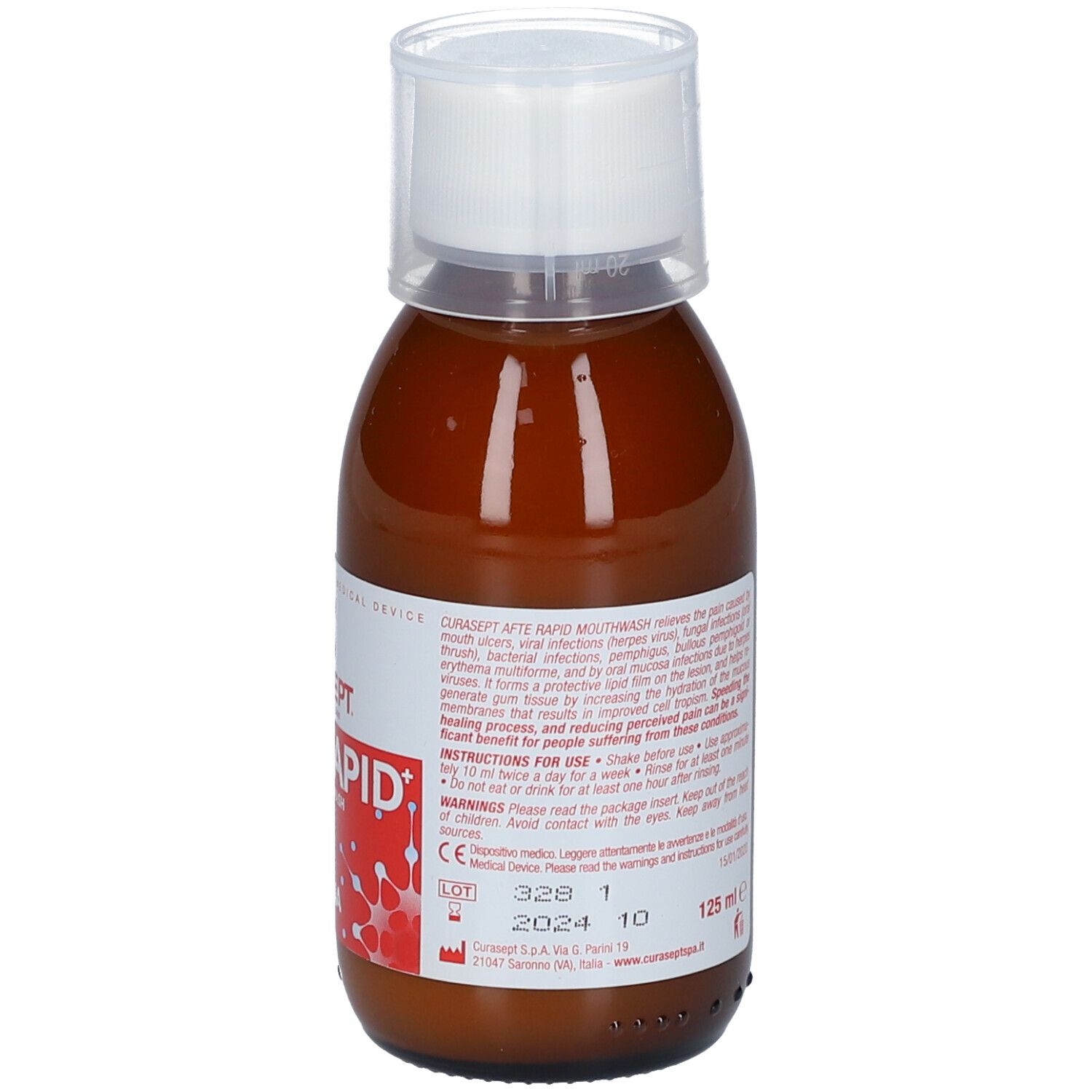 Liquido marrone in bottiglia con tappo bianco. Etichetta con testo, numero di lotto e data di scadenza.