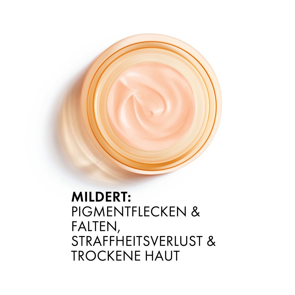 Vista dall'alto della crema. Testo: Riduce macchie e rughe, perdita di tono e pelle secca.