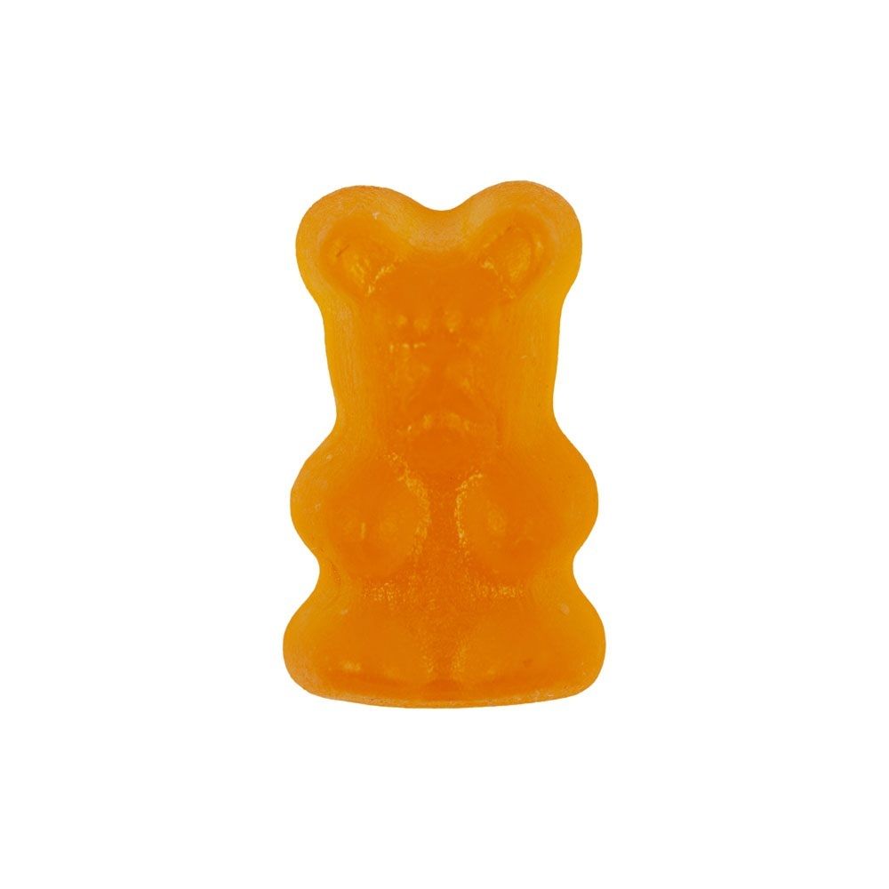 Un singolo orsetto multivitaminico arancione.