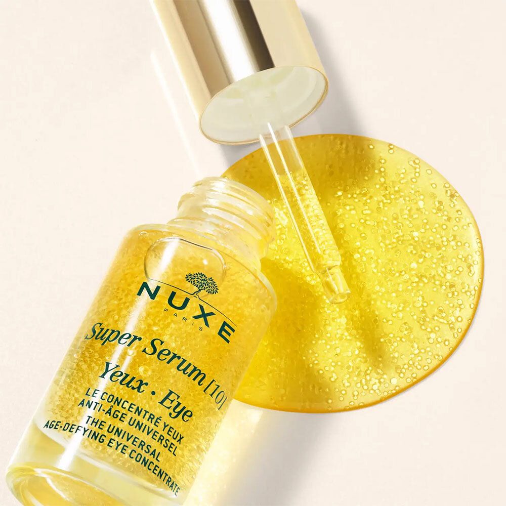Flacone di concentrato occhi con pipetta. Liquido dorato. Scritta: NUXE Super Serum [10] Yeux • Eye.