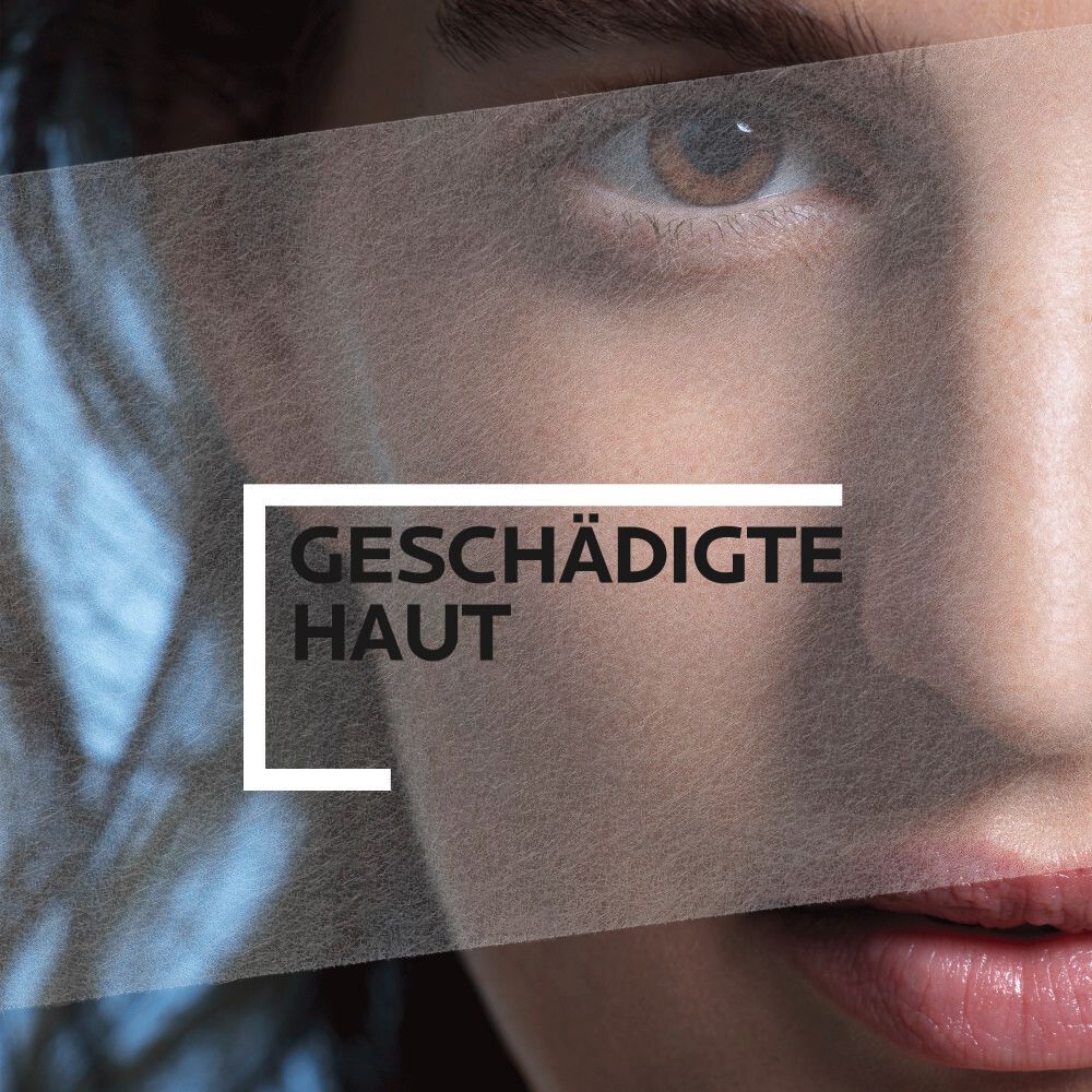 Primo piano di un viso. Testo: Pelle danneggiata. Viso parzialmente coperto.