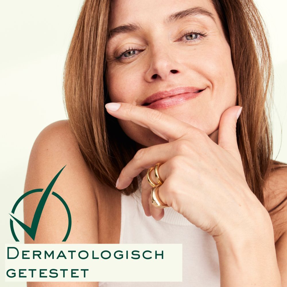 Donna con mano sul mento. Testo: Dermatologicamente testato. Logo: spunta verde.