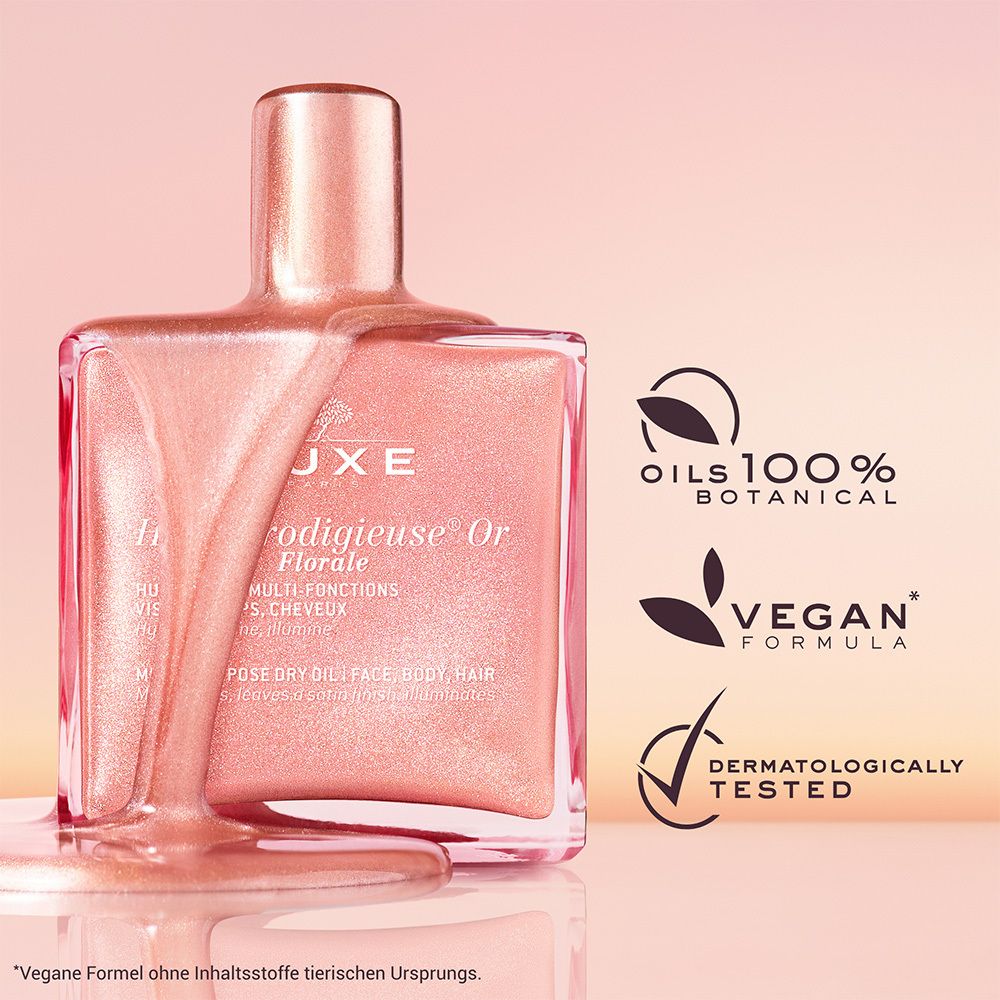 Nuxe Huile Prodigieuse® Or Florale. Flacone rosa con tappo dorato. Logo vegano.