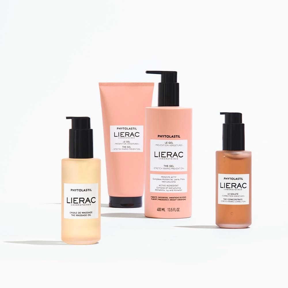 Quattro prodotti: flacone d'olio, tubo, flacone e flaconcino. Tutti con logo LIERAC e nome del prodotto.