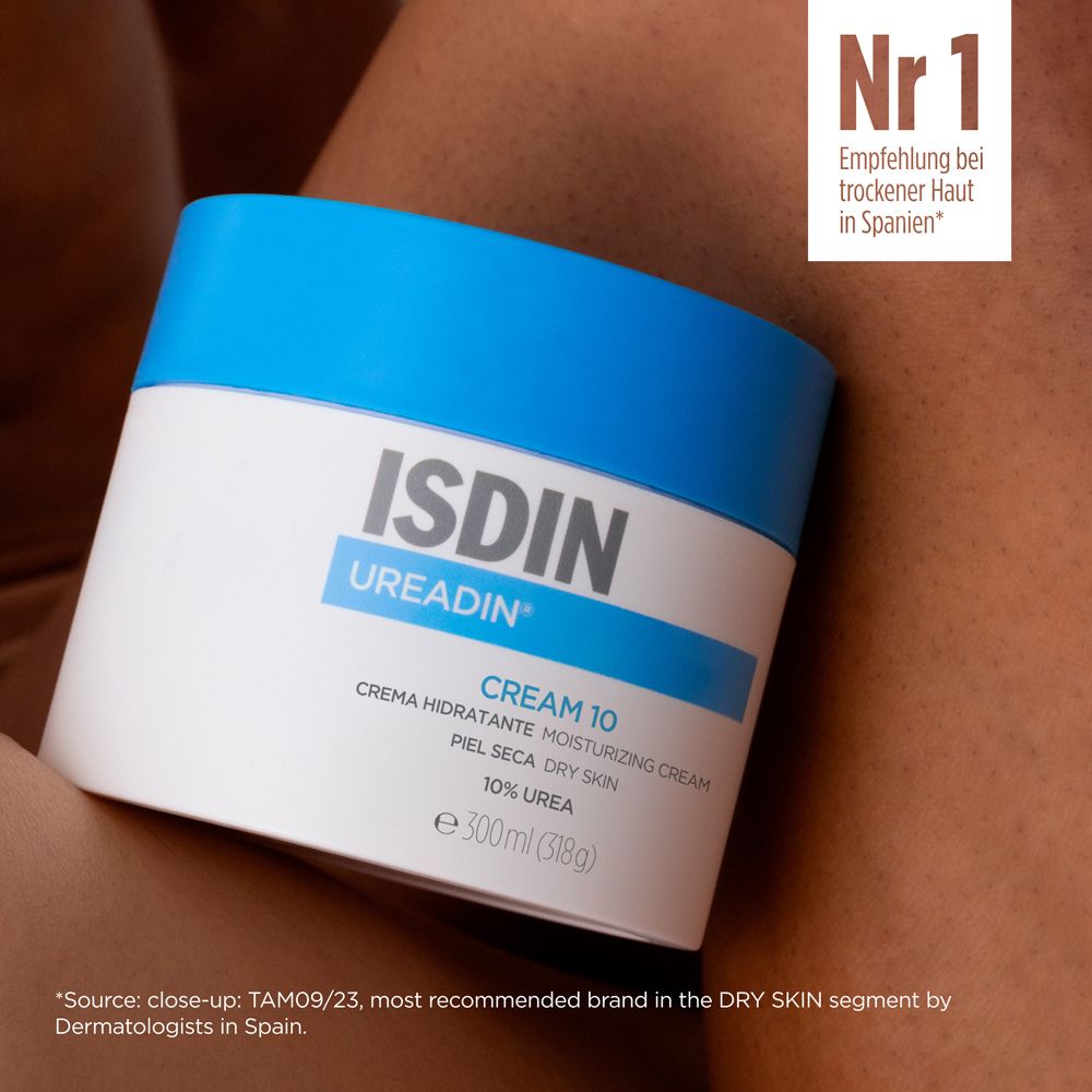 Vaso di crema con coperchio blu. Scritta: ISDIN UREADIN CREAM 10. Testo: Raccomandazione per la pelle secca in Spagna.