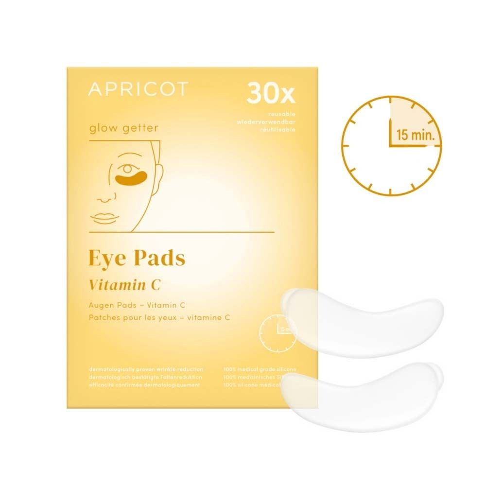 Confezione di cuscinetti per gli occhi. Contiene 30 cuscinetti. Stampato: APRICOT, Eye Pads Vitamin C. Due cuscinetti accanto.