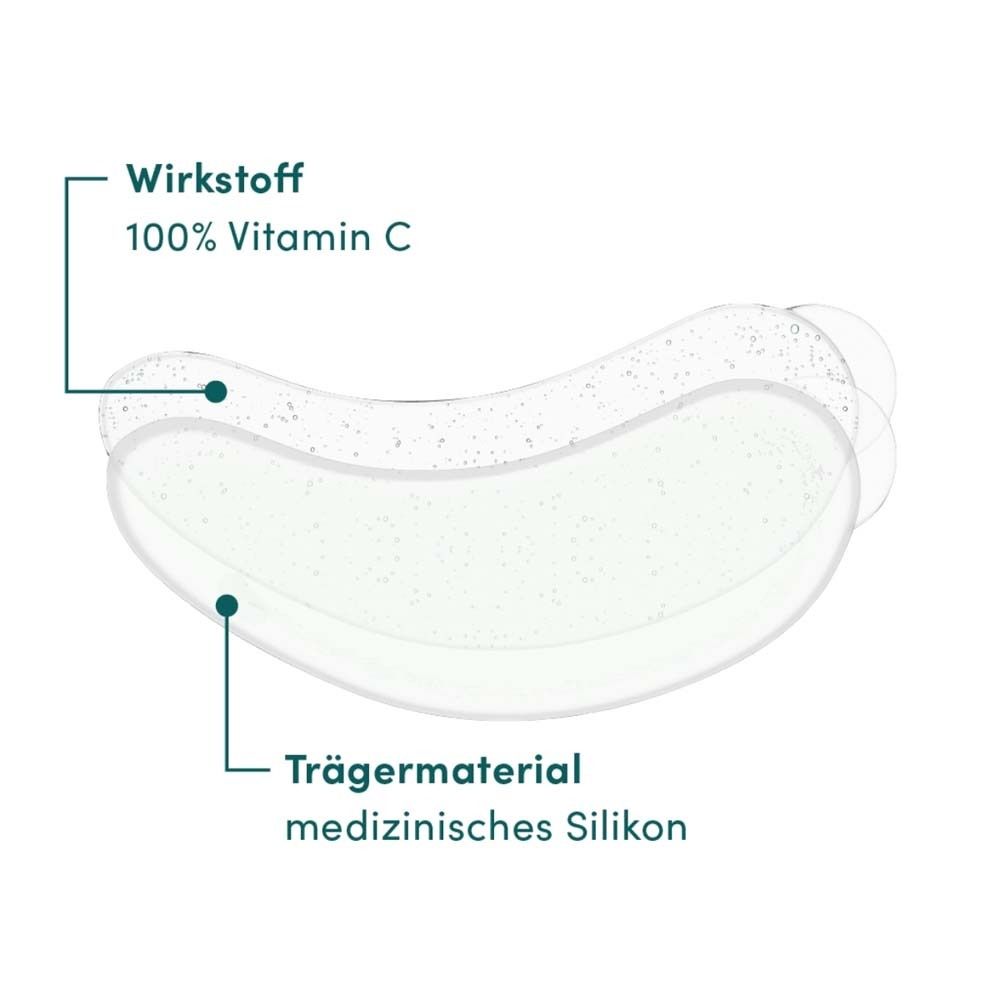 Cuscinetto per occhi con informazioni sugli ingredienti. Principio attivo: 100% vitamina C. Materiale di supporto: silicone medicale.