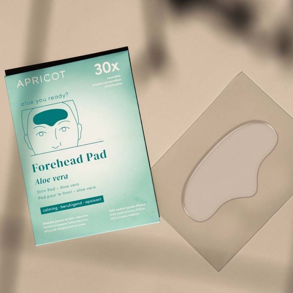 Confezione e Forehead Pad. Marchio APRICOT. Testo: Forehead Pad Aloe vera. 30x. Riutilizzabile.