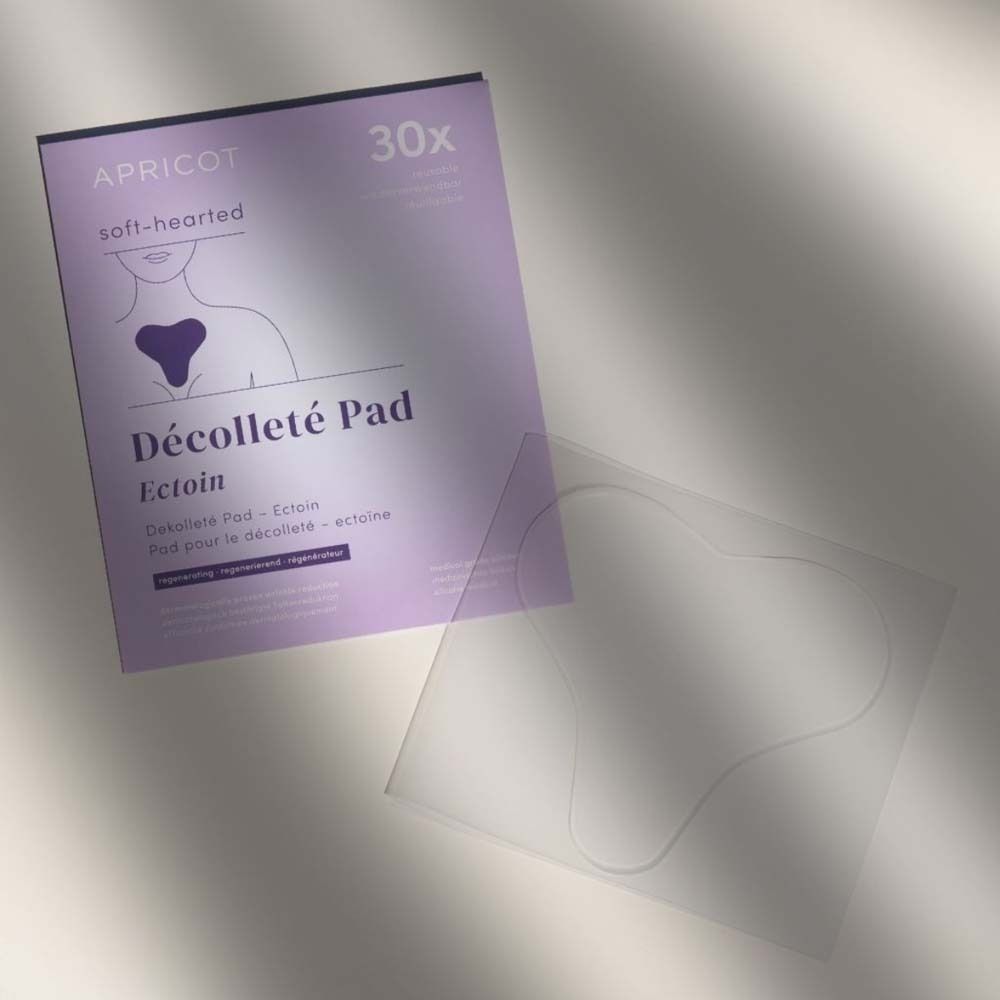 Confezione e pad Décolleté trasparente. Scritta: APRICOT, Décolleté Pad, Ectoina.