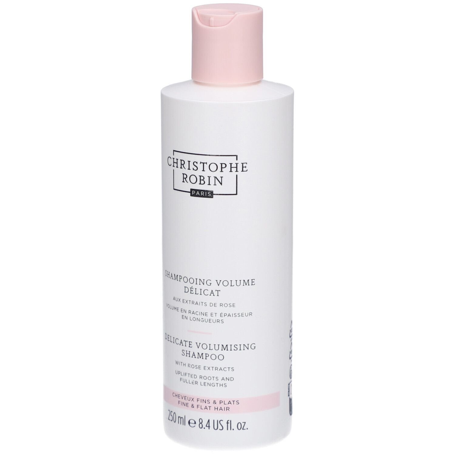 Flacone bianco con tappo rosa. Scritta: Christophe Robin Paris. Testo: Shampooing Volume Délicat, Delicate Volumising Shampoo.