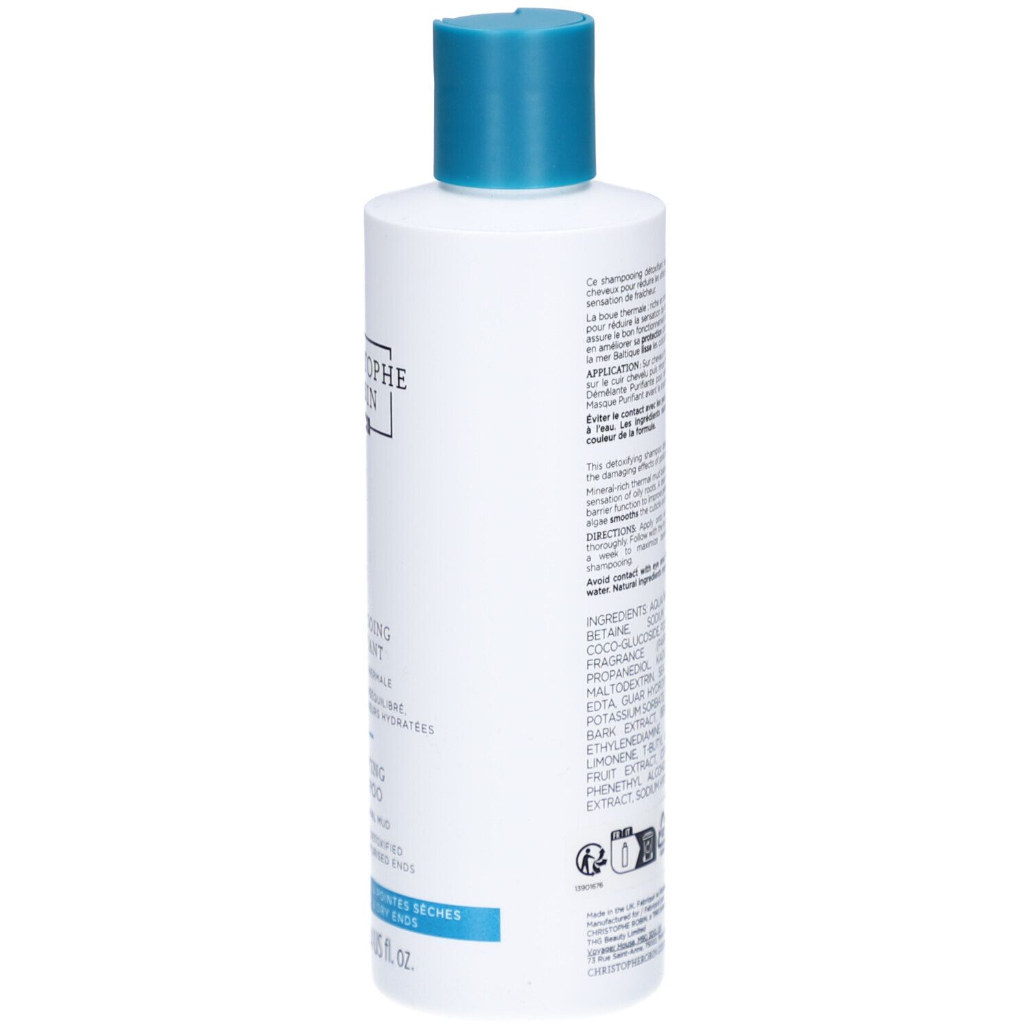 Retro del flacone di shampoo. Testo multilingue, ingredienti e informazioni del produttore.