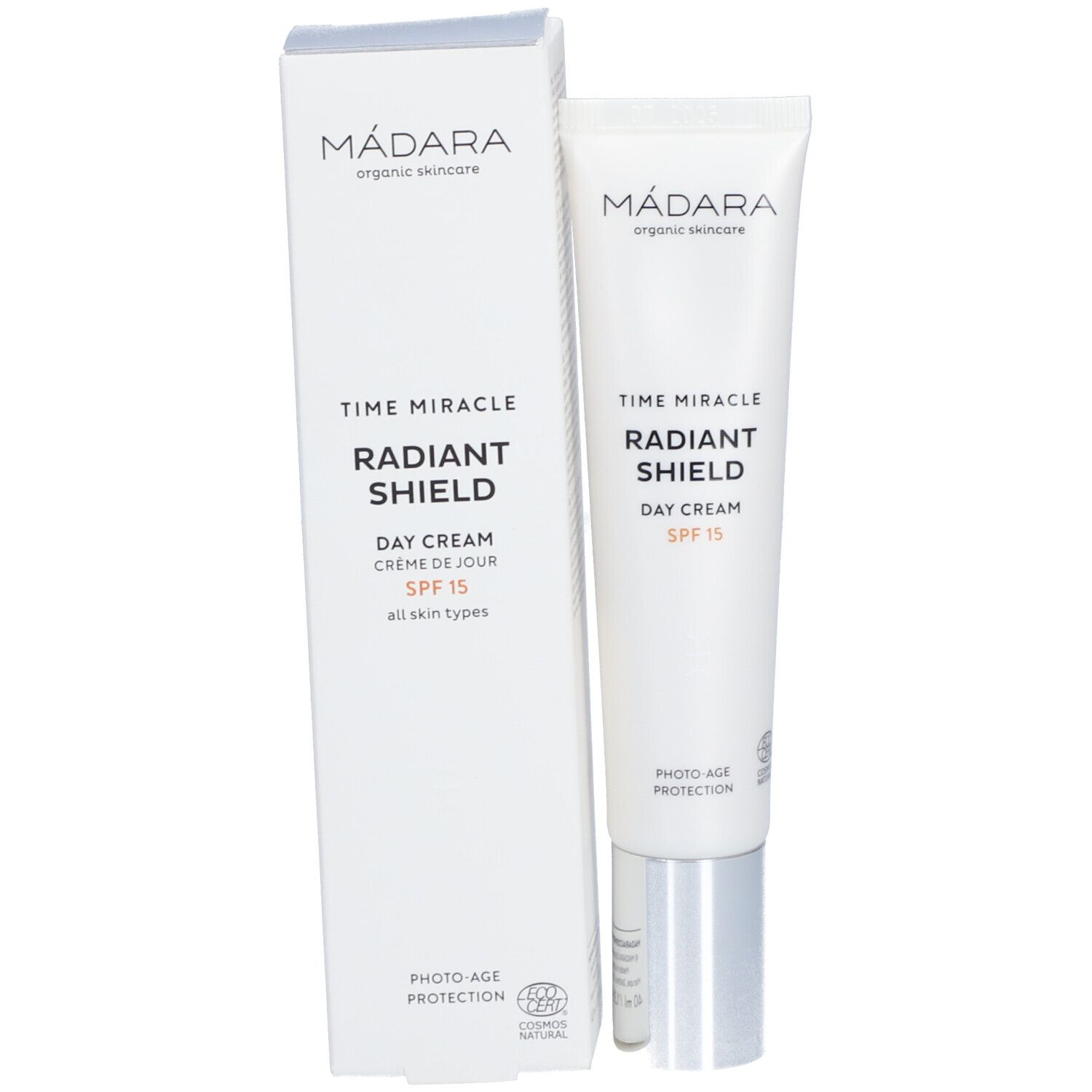 Confezione del prodotto con tubo. Scatola e tubo bianchi. Scritta: MÁDARA, TIME MIRACLE RADIANT SHIELD DAY CREAM SPF 15. Certificazione biologica.