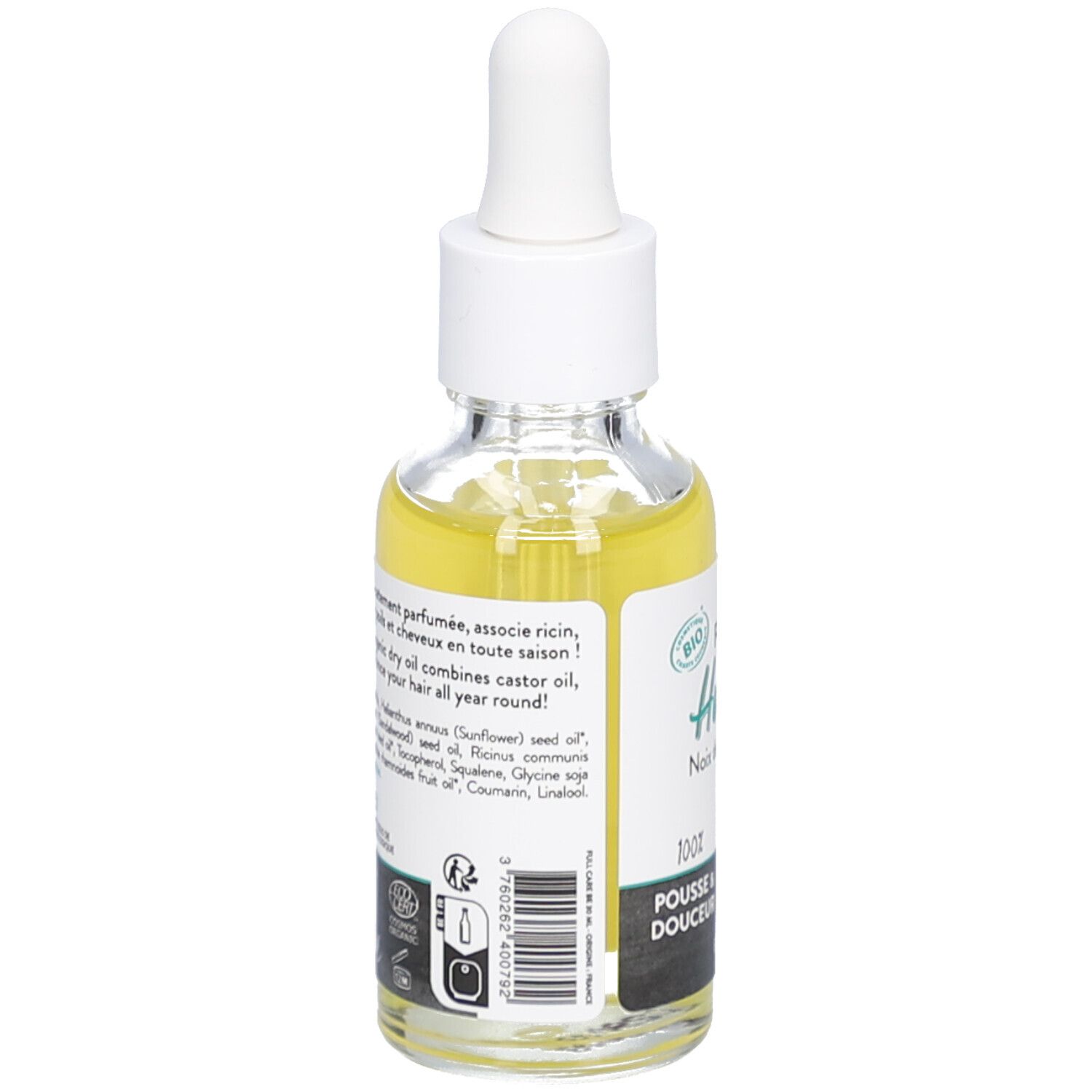 Bottiglia di vetro con olio giallo e pipetta. Etichetta con informazioni e sigillo bio.