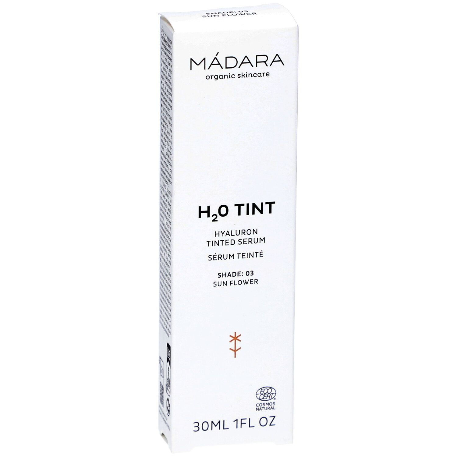 Confezione bianca con testo. Marchio: MÁDARA. Prodotto: H2O TINT Hyaluron Tinted Serum. Tonalità: 03 Sun Flower. 30ml/1FL OZ. Logo.