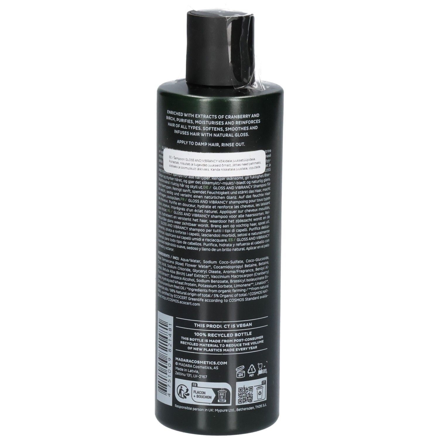 Retro di un flacone di shampoo verde. L'etichetta contiene ingredienti, istruzioni e sigilli.